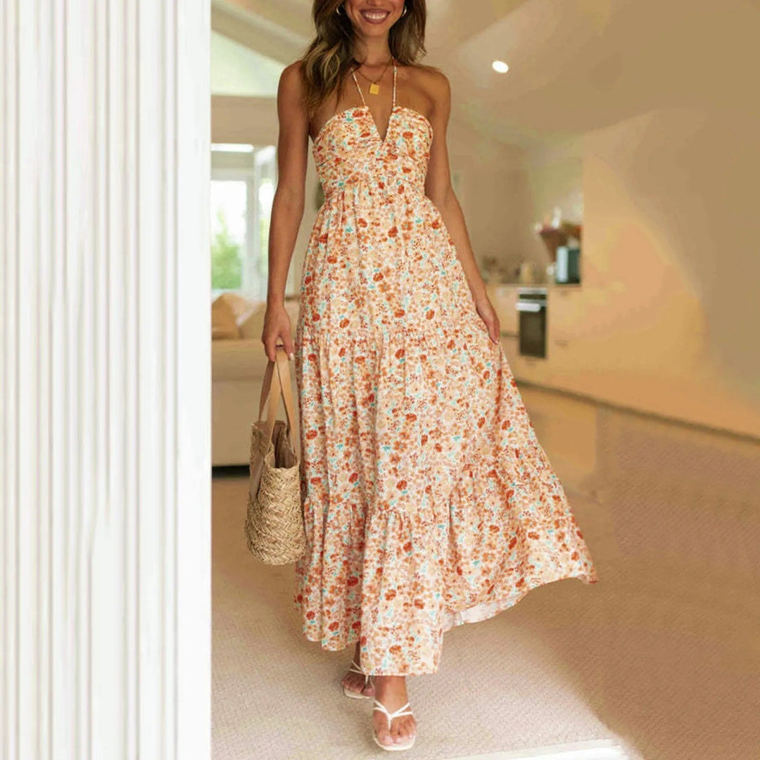 Tiered maxi dress featuring an adjustable halter neckline, made from lightweight breathable fabric, perfect for both casual and formal occasions. 2
