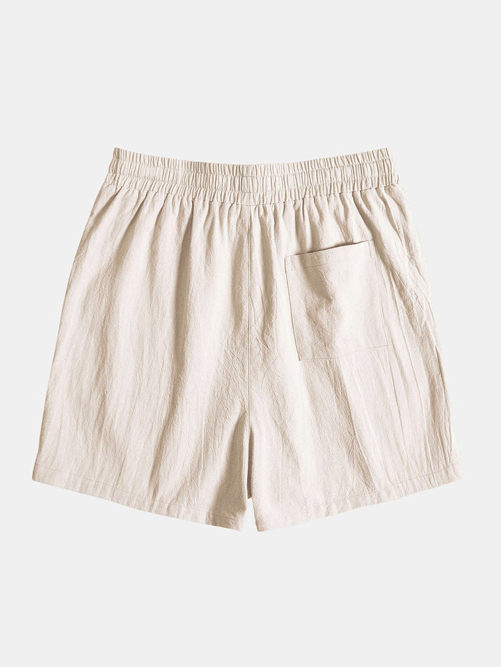 Tropical print shirt paired with textured cotton shorts, featuring a regular fit and 5-inch inseam, perfect for summer outings. 4