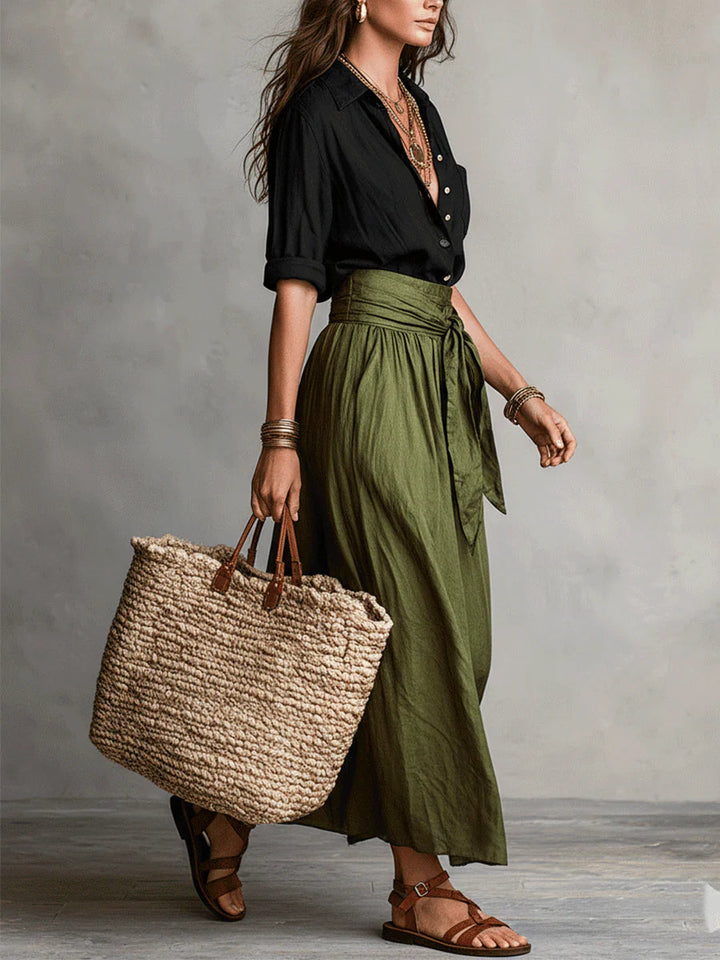 Two-piece women's outfit set featuring a stylish black button shirt and an olive green midi skirt, designed for plus size clothing. 1