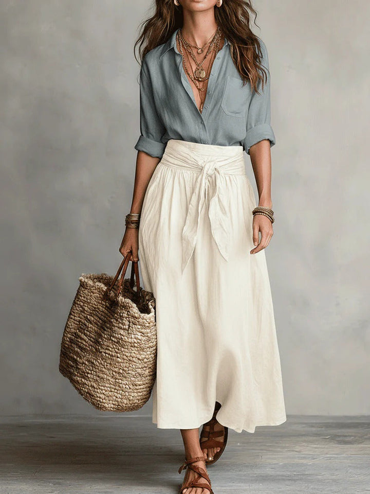 Two-piece women's outfit set featuring a stylish black button shirt and an olive green midi skirt, designed for plus size clothing. 8
