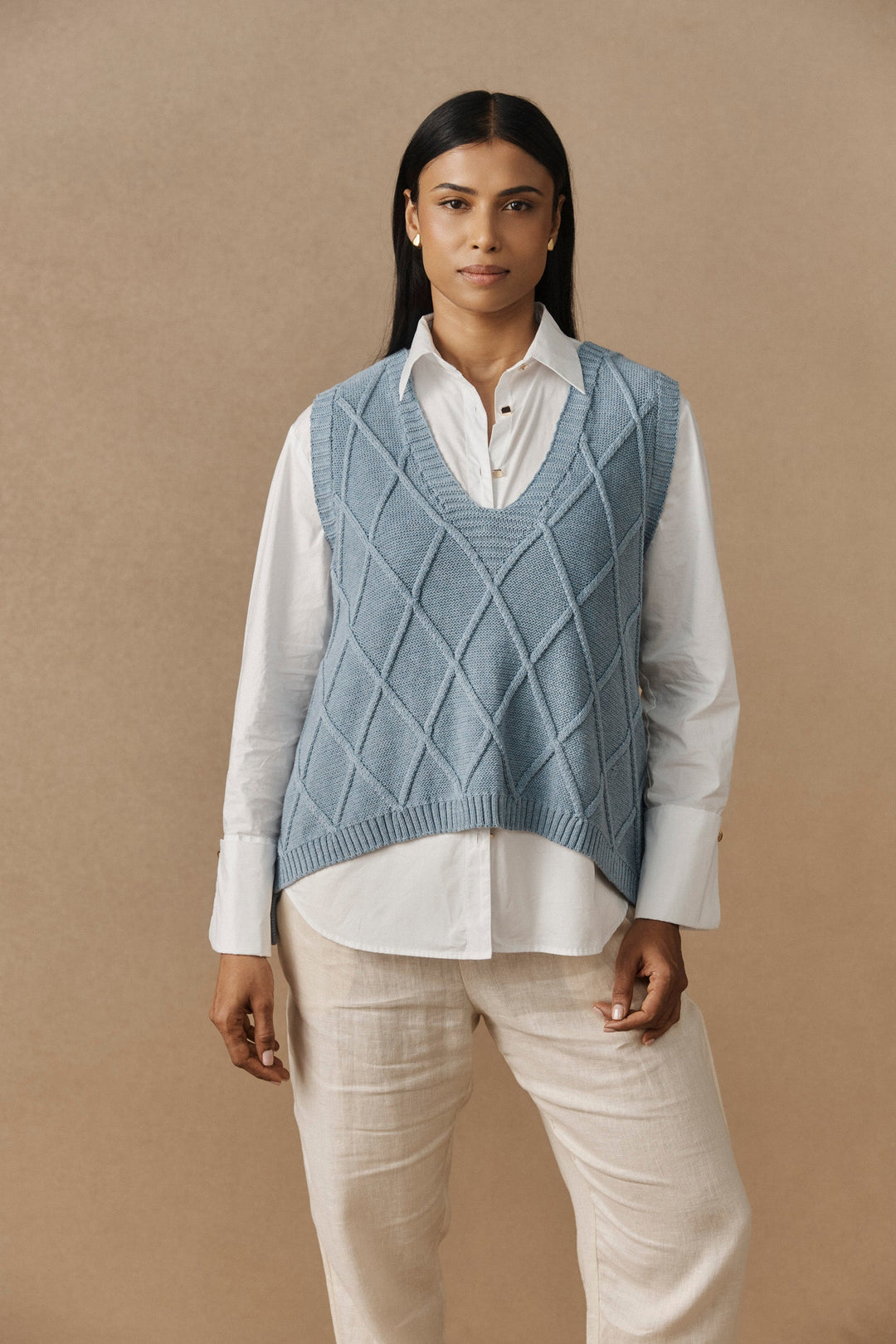 V-Neck Knitted Vest for Women in Breathable Cotton featuring a trendy checkerboard pattern, perfect for stylish layering. 1