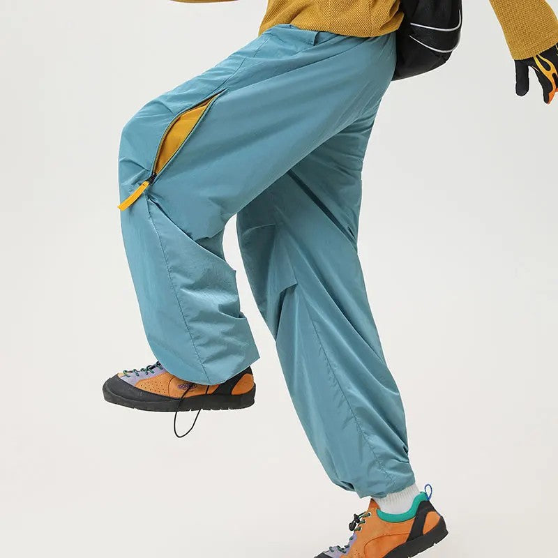 Waterproof hiking pants featuring quick-dry fabric and a comfort stretch waist, designed for durability and flexibility during outdoor trekking for both men and women. 1