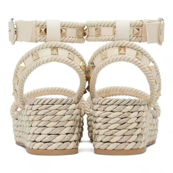 Wedge sandals for women featuring a studded ankle strap and Roman-inspired elevated platform heels, perfect for stylish summer outfits. 3