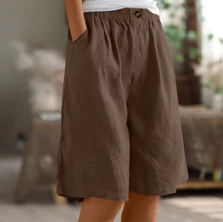 Wide leg Bermuda shorts for women featuring an elastic waist and convenient side pockets, designed for a casual knee-length fit perfect for summer outings. 11