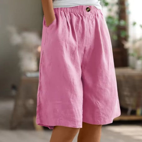 Wide leg Bermuda shorts for women featuring an elastic waist and convenient side pockets, designed for a casual knee-length fit perfect for summer outings. 4