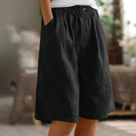 Wide leg Bermuda shorts for women featuring an elastic waist and convenient side pockets, designed for a casual knee-length fit perfect for summer outings. 9