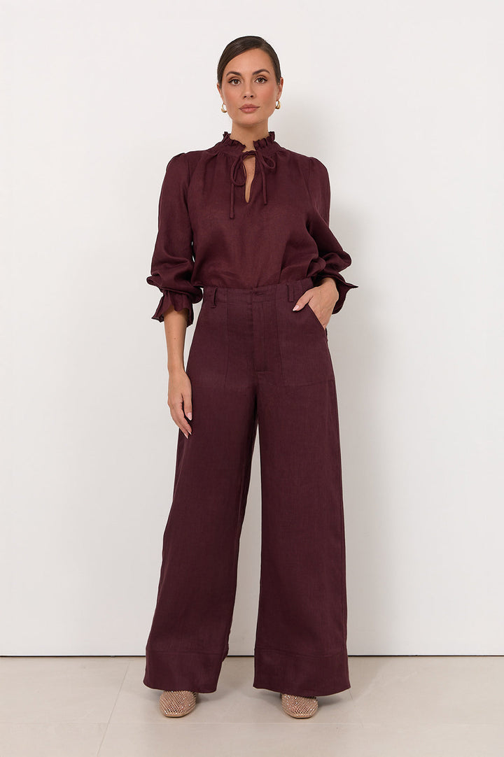 Wide leg linen pants for women in plum color featuring a zip fly and front pockets, perfect for stylish and comfortable summer wear. 0