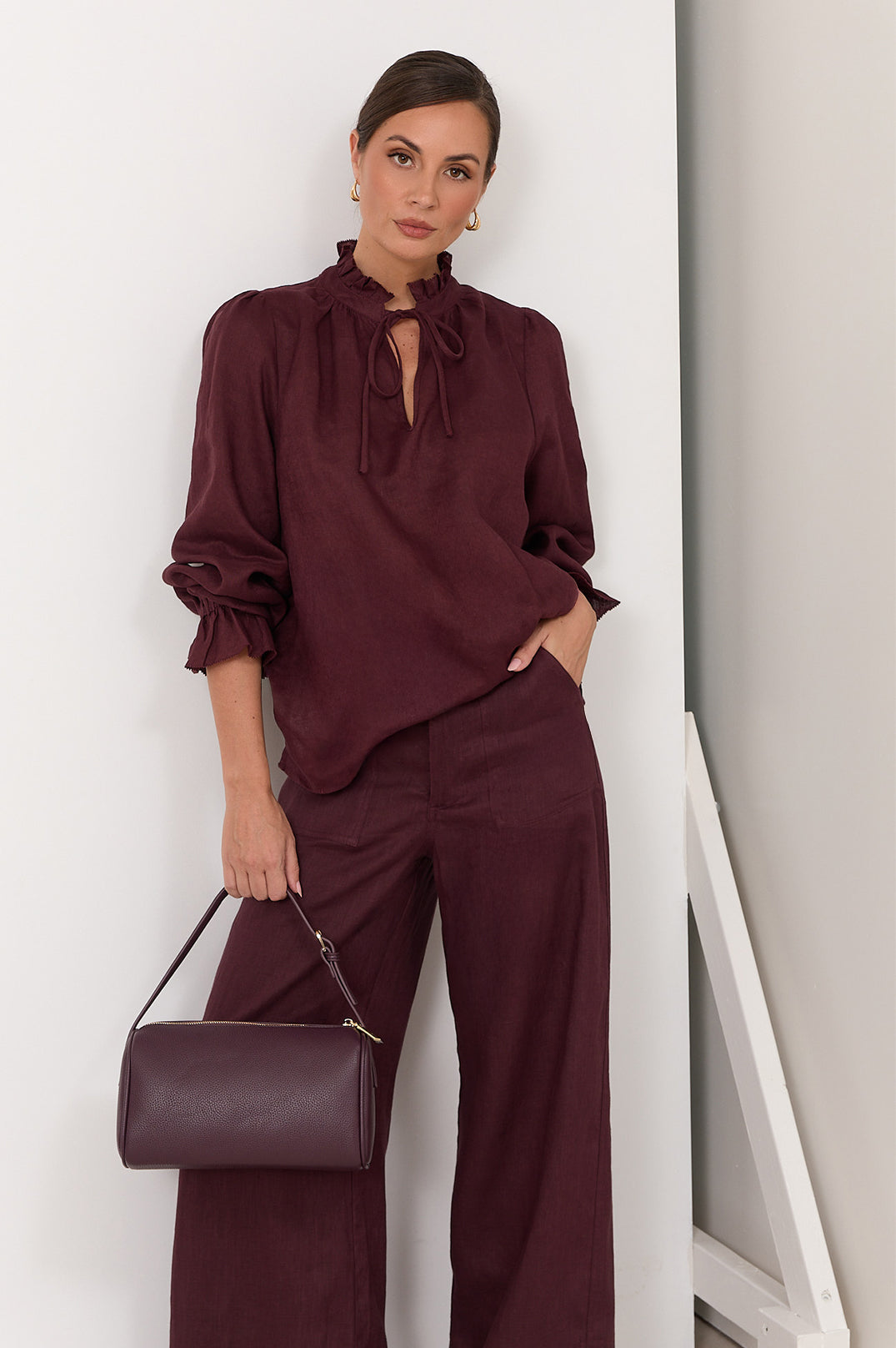 Wide leg linen pants for women in plum color featuring a zip fly and front pockets, perfect for stylish and comfortable summer wear. 1