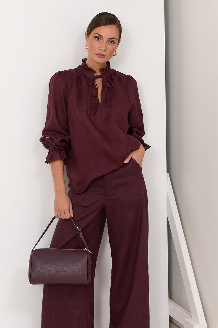 Wide leg linen pants for women in plum color featuring a zip fly and front pockets, perfect for stylish and comfortable summer wear. 1