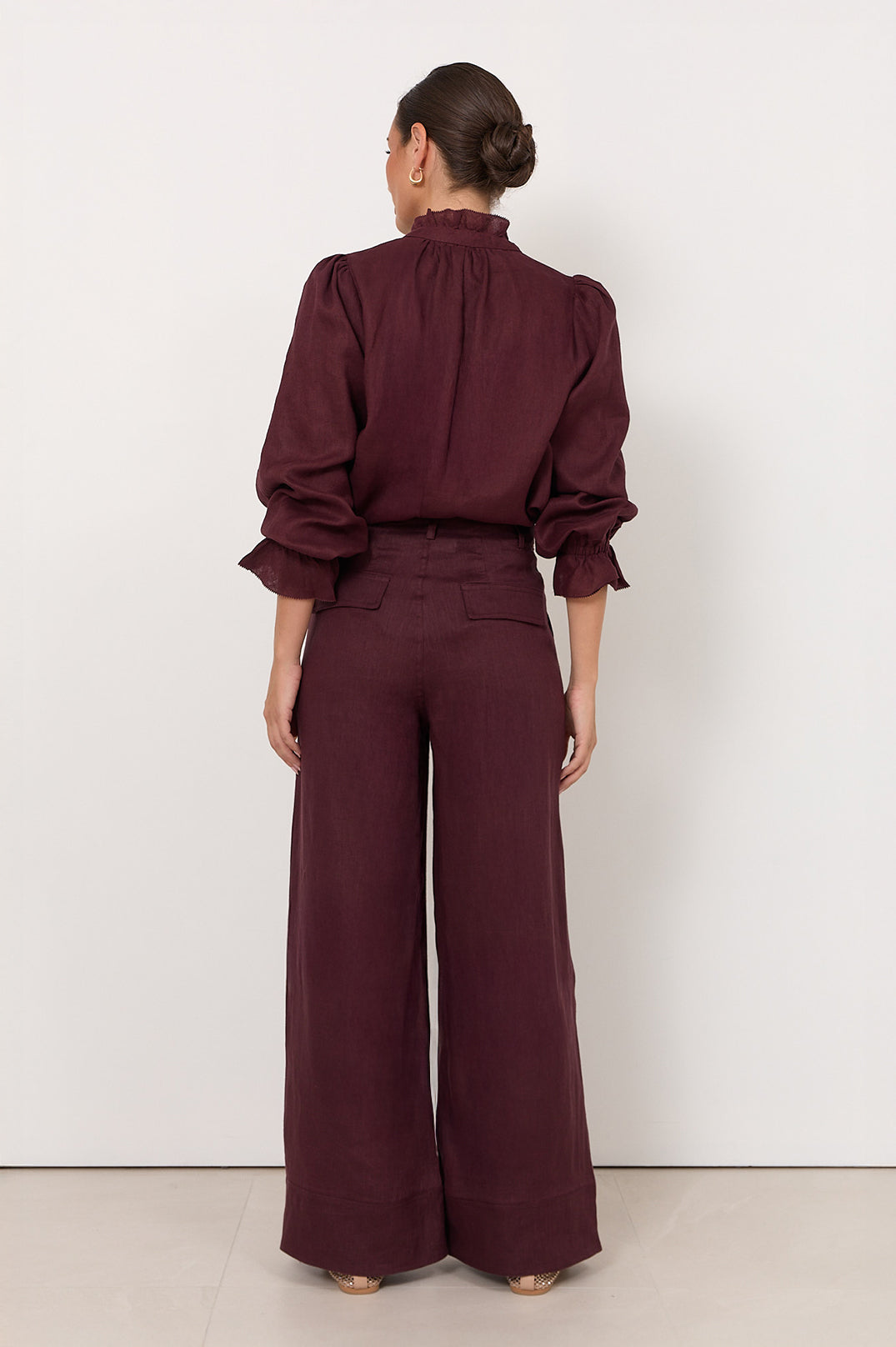 Wide leg linen pants for women in plum color featuring a zip fly and front pockets, perfect for stylish and comfortable summer wear. 3