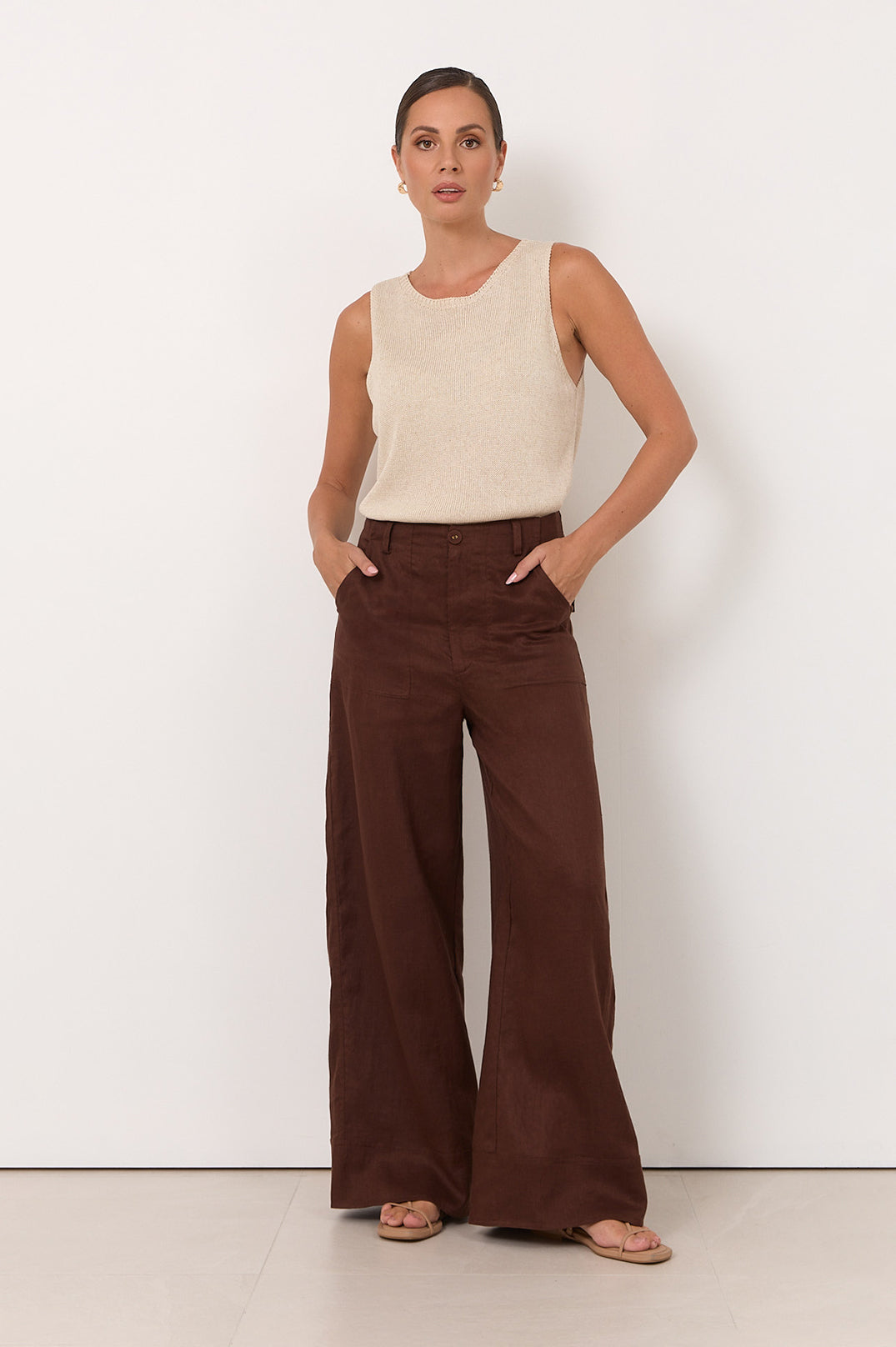 Wide leg linen pants for women in chocolate color, featuring a zip fly and pockets, perfect for casual style and comfortable wear. 2