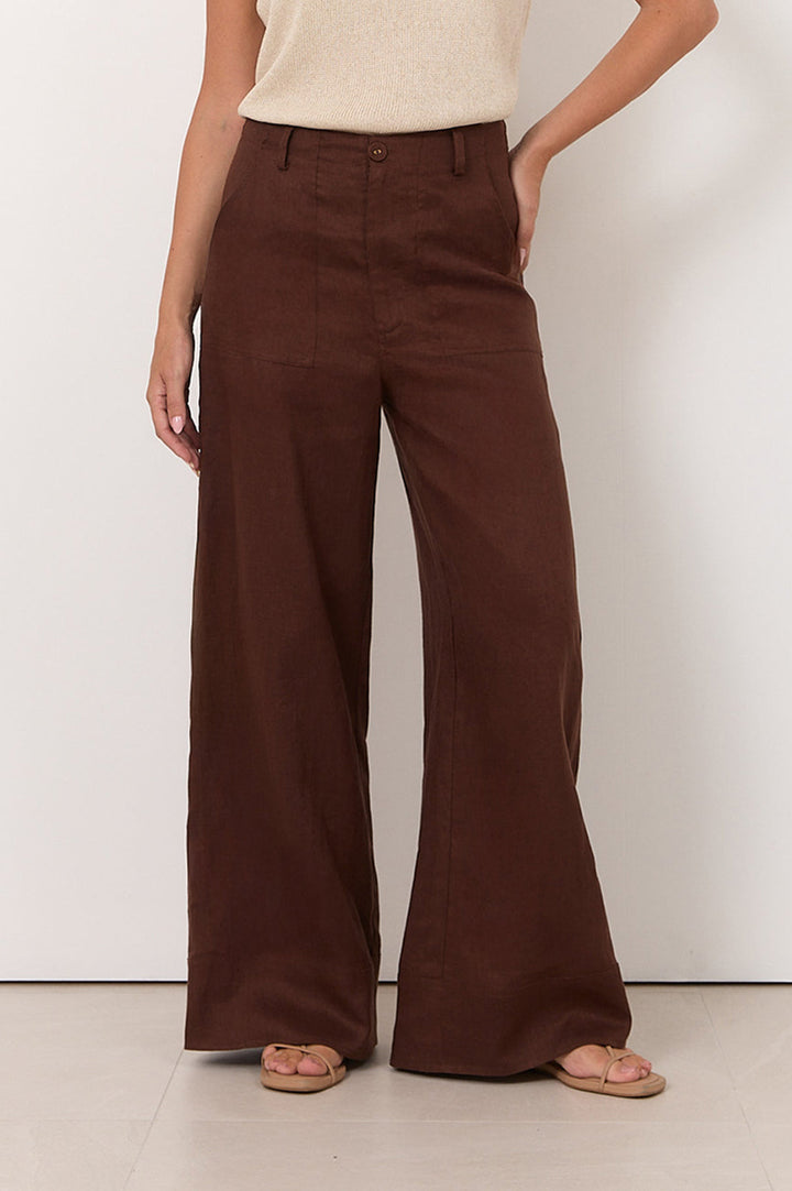 Wide leg linen pants for women in chocolate color, featuring a zip fly and pockets, perfect for casual style and comfortable wear. 3