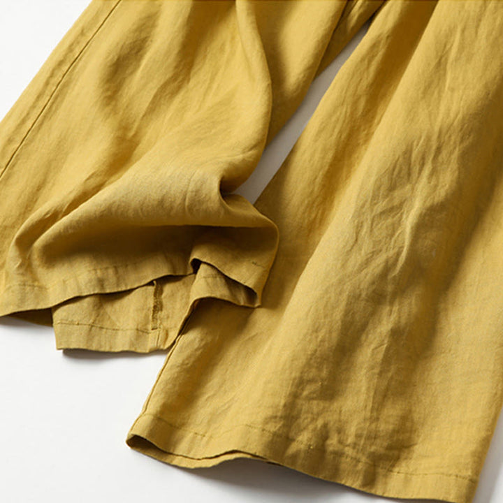 Wide leg pants for women featuring a high waist design, pockets, and made from a flowy cotton-linen blend for casual comfort and style. 3