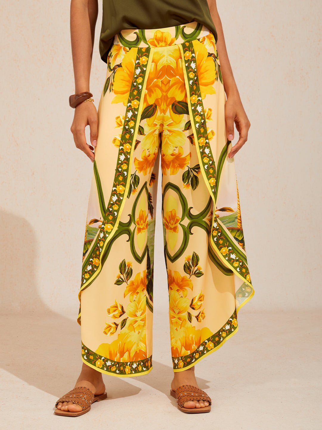 Wide leg pants for women featuring a vibrant tropical palm print, designed in a relaxed fit with luxurious satin fabric, presented in an eye-catching peacock blue 13
