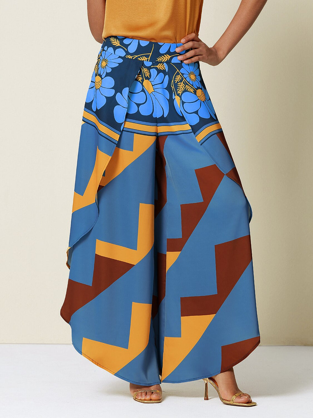 Wide leg pants for women featuring a vibrant tropical palm print, designed in a relaxed fit with luxurious satin fabric, presented in an eye-catching peacock blue 15