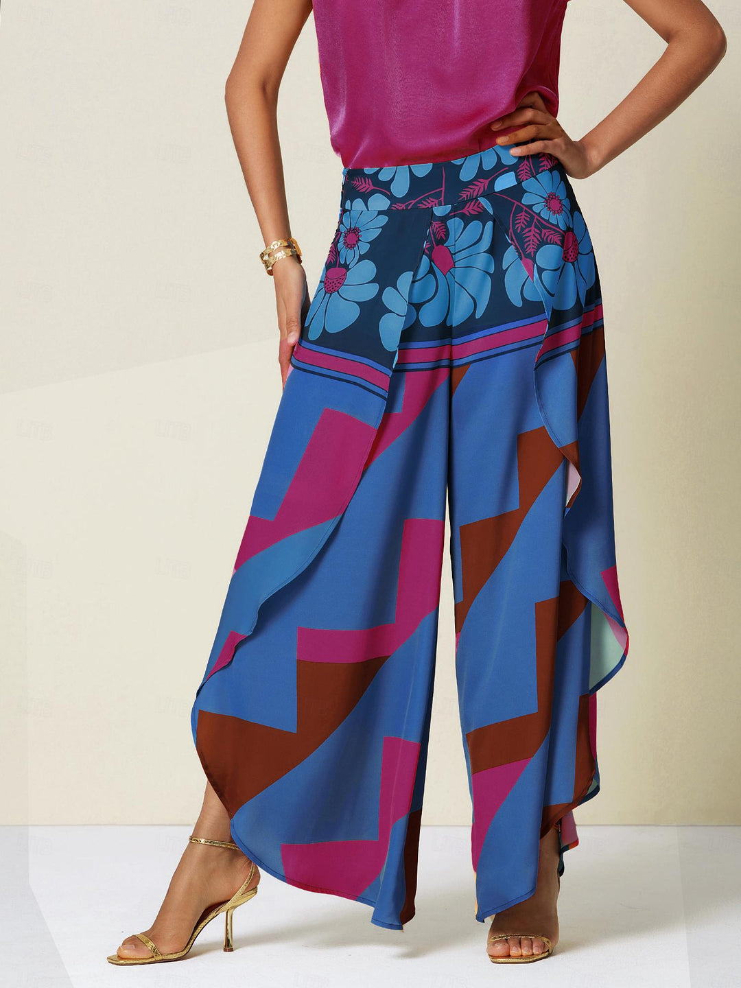 Wide leg pants for women featuring a vibrant tropical palm print, designed in a relaxed fit with luxurious satin fabric, presented in an eye-catching peacock blue 16