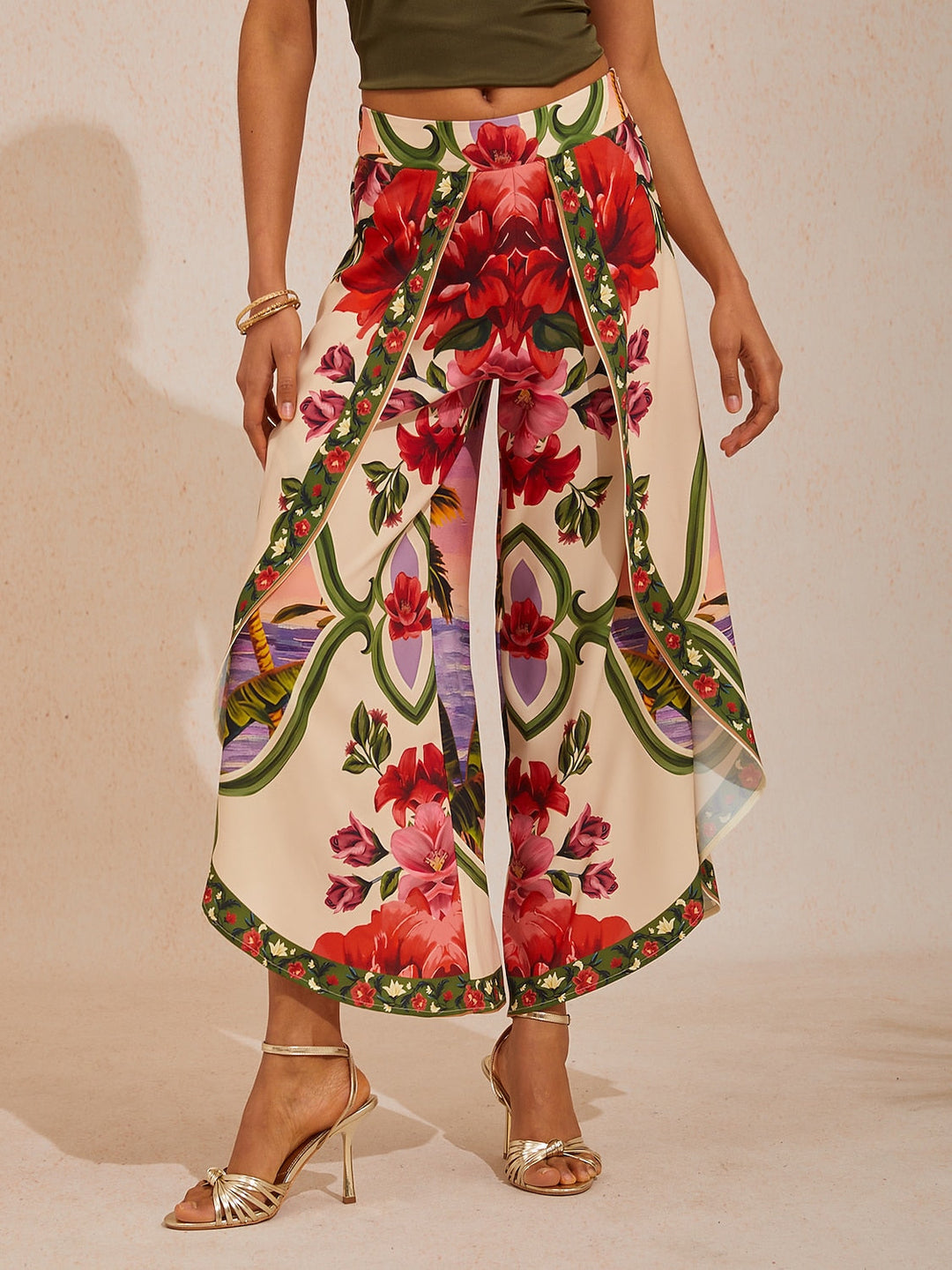 Wide leg pants for women featuring a vibrant tropical palm print, designed in a relaxed fit with luxurious satin fabric, presented in an eye-catching peacock blue 3