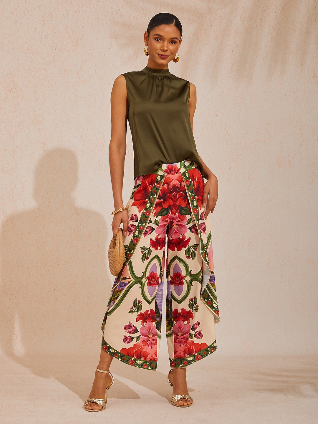 Wide leg pants featuring a high-rise waist in a silky satin fabric with a vibrant tropical floral print, perfect for stylish summer outings. 1