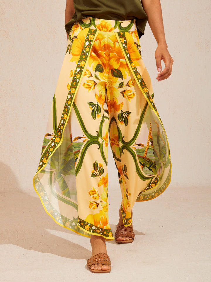 Wide leg pants featuring a high-rise waist in a silky satin fabric with a vibrant tropical floral print, perfect for stylish summer outings. 6