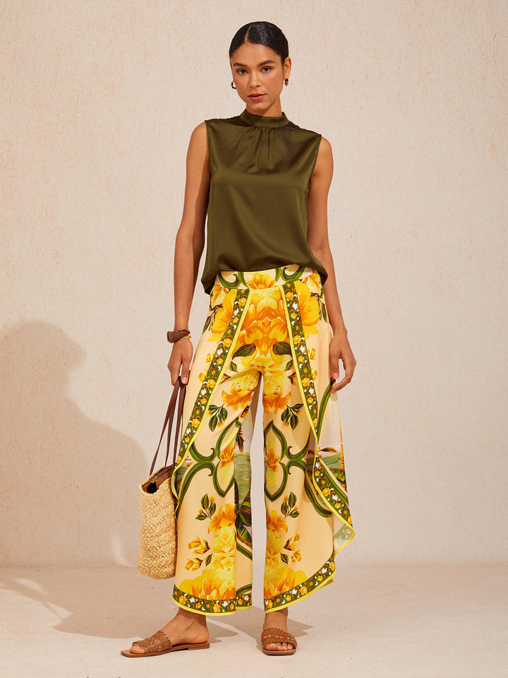 Wide leg pants featuring a high-rise waist in a silky satin fabric with a vibrant tropical floral print, perfect for stylish summer outings. 8