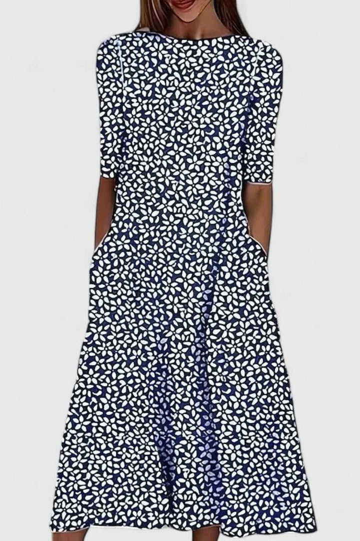 Women's A-Line Midi Dress with Pockets in breathable cotton featuring a blue floral pattern on a white background. 2