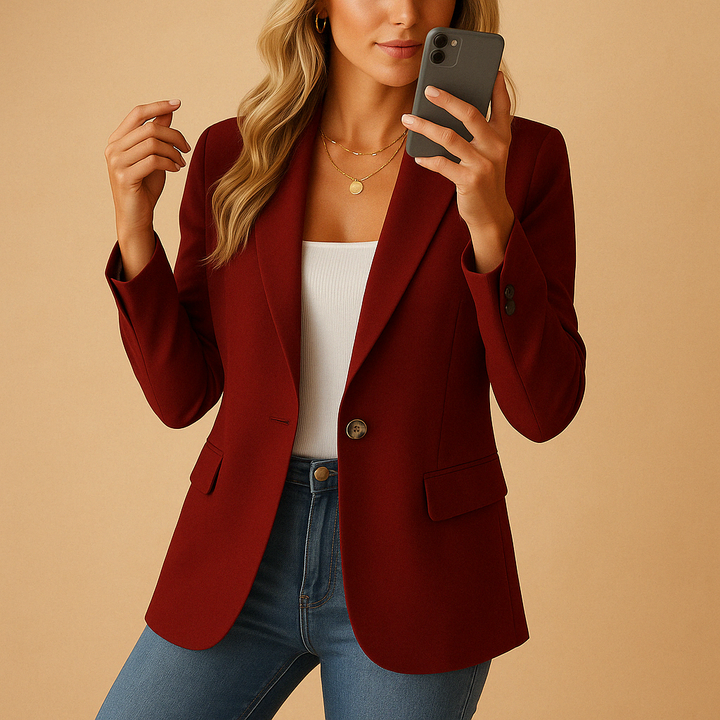 Women's blazer featuring notch lapels and a single-button closure, designed for a tailored structured fit, available in classic black or white. 4