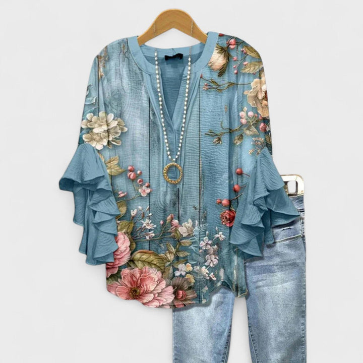 Women's blouse featuring ruffled sleeves, designed for summer with a lightweight fabric, perfect for an elegant casual style. 0