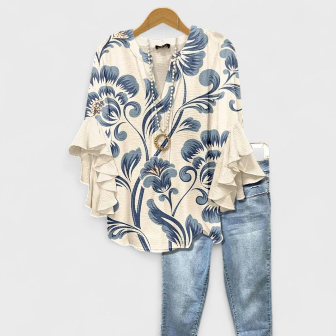 Women's blouse featuring ruffled sleeves, designed for summer with a lightweight fabric, perfect for an elegant casual style. 1