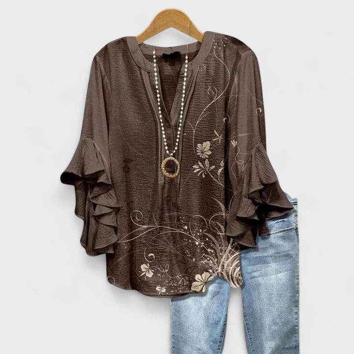 Women's blouse featuring ruffled sleeves, designed for summer with a lightweight fabric, perfect for an elegant casual style. 4