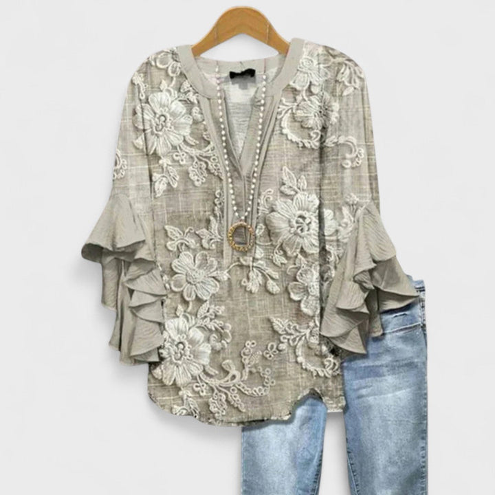 Women's blouse featuring ruffled sleeves, designed for summer with a lightweight fabric, perfect for an elegant casual style. 7
