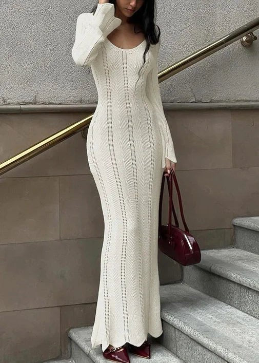 Women's bodycon maxi dress featuring long sleeves and a scoop neckline, crafted from textured knit fabric, perfect for elegant evening wear. 0