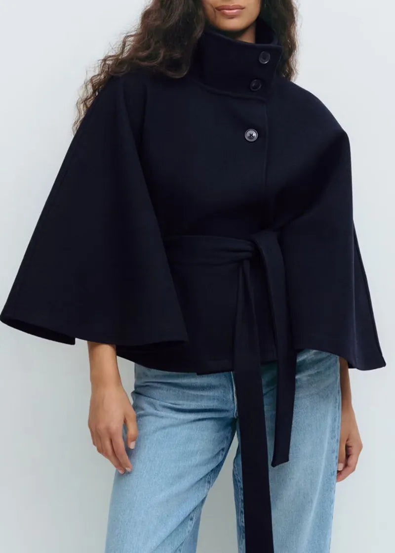Women's cape coat featuring an adjustable belt and high neckline, crafted from soft premium fabric for elegant winter layering. 4