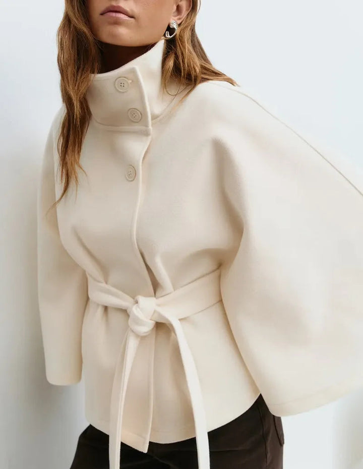 Women's cape coat featuring an adjustable belt and high neckline, crafted from soft premium fabric for elegant winter layering. 5