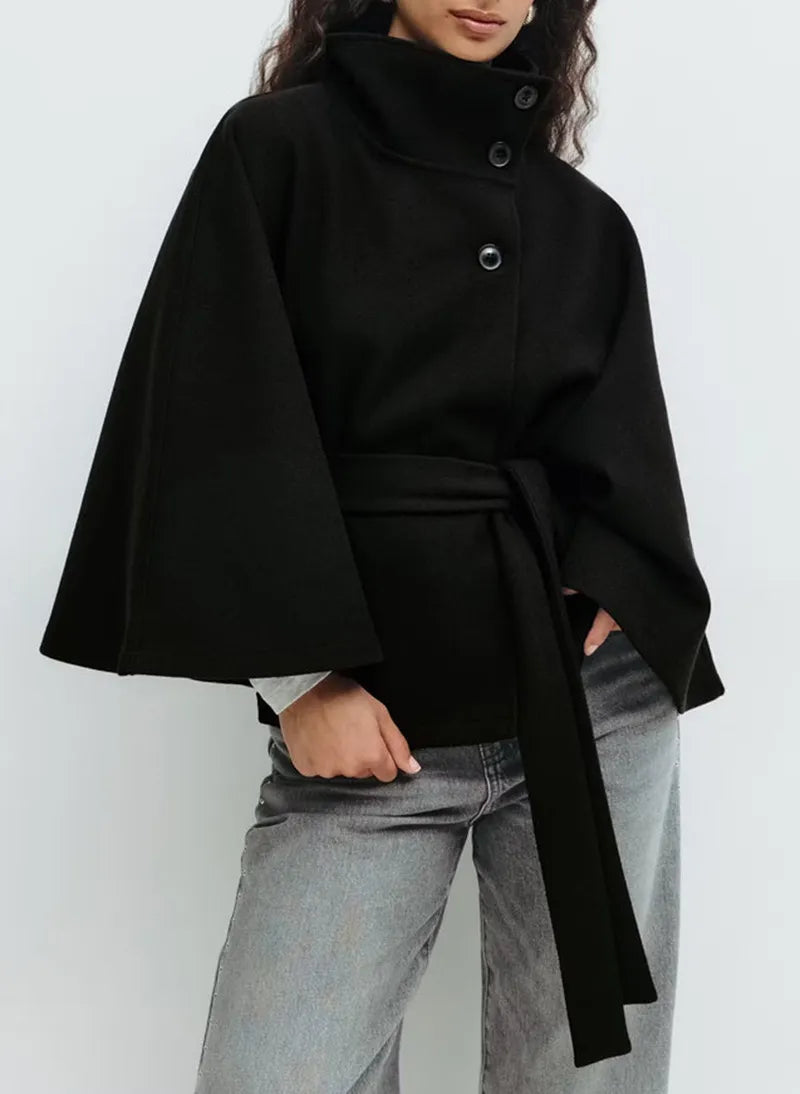 Women's cape coat featuring an adjustable belt and high neckline, crafted from soft premium fabric for elegant winter layering. 7