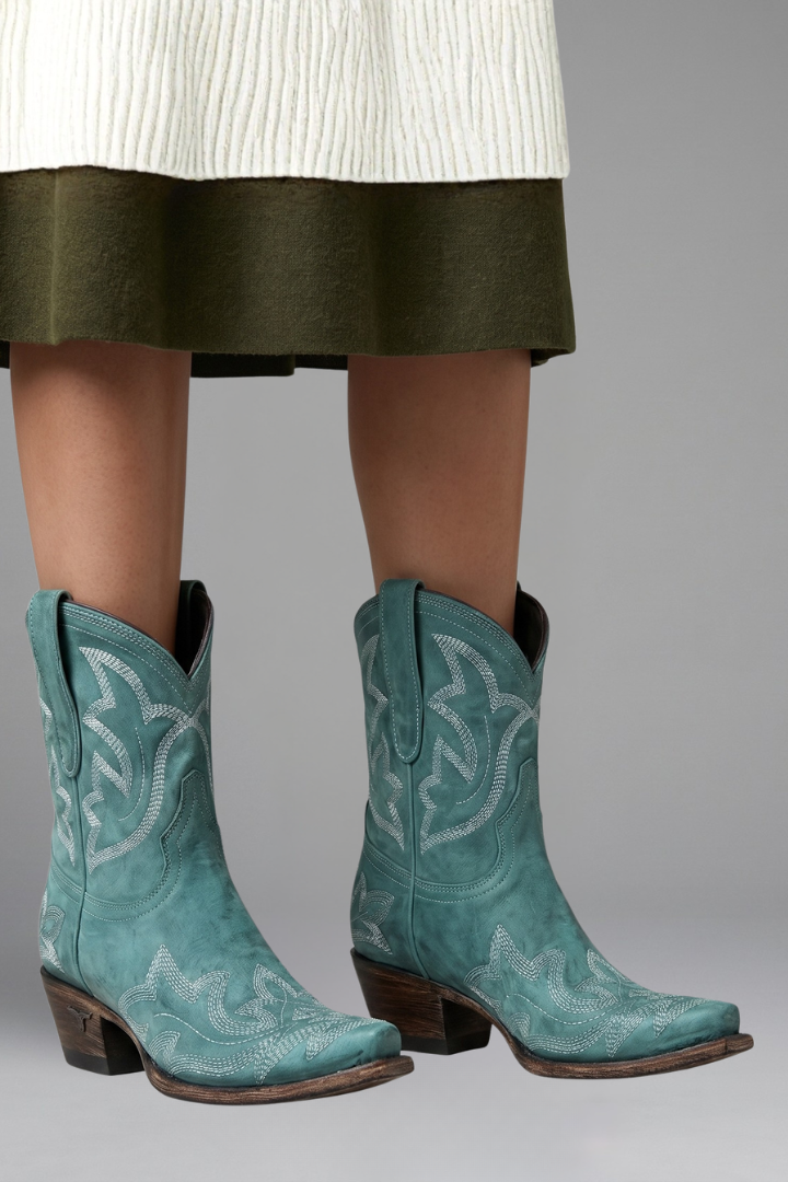 Women's cowboy boots featuring a leather upper, pointed toe, and western embroidered ankle design, complete with dual pull tabs for easy wear. 6