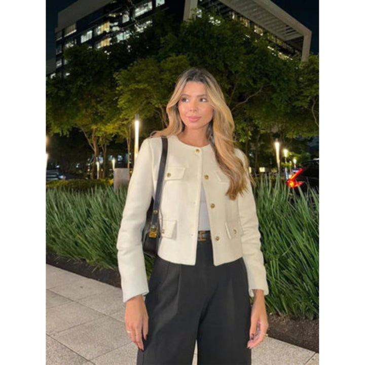 Women's cropped jacket featuring a tailored cream design, structured fit, and elegant gold button closure, perfect for stylish layering. 2