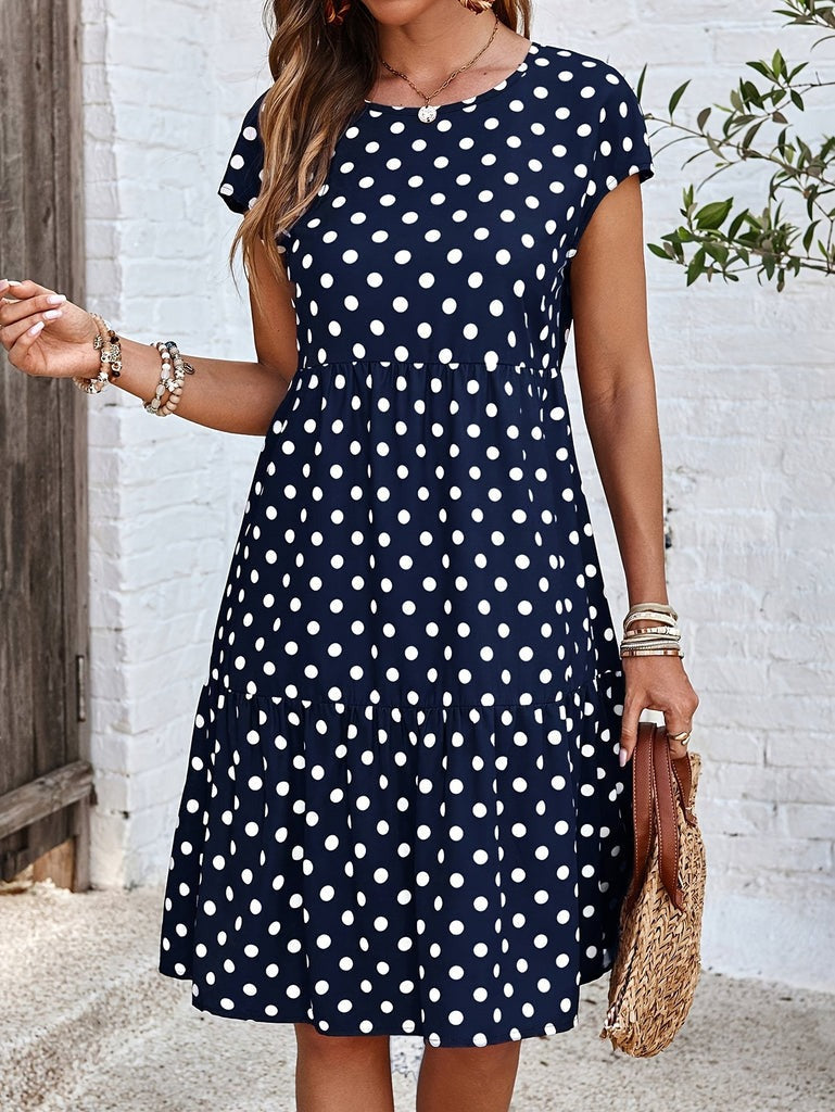 Women's midi dress with short sleeves in a soft polyester blend featuring a stylish polka dot print, perfect for summer outings. 1