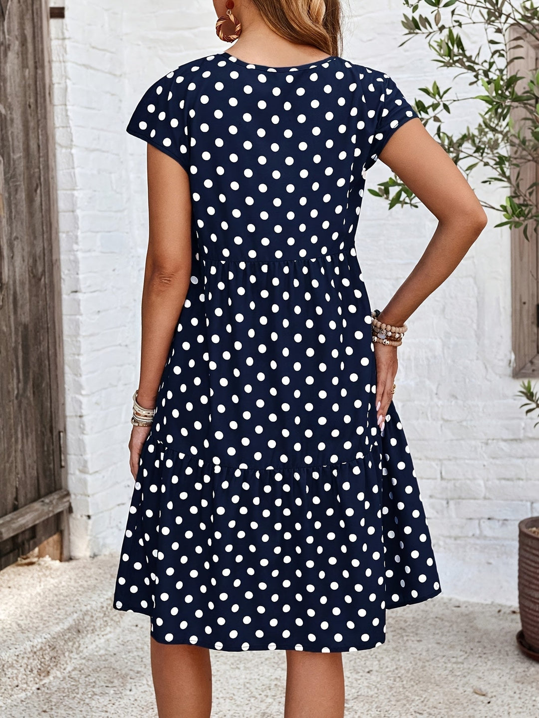 Women's midi dress with short sleeves in a soft polyester blend featuring a stylish polka dot print, perfect for summer outings. 2