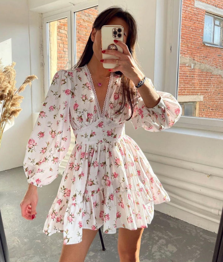 Women's floral mini dress featuring balloon sleeves and a crochet lace V-neck, perfect for summer outings and warm weather occasions. 0