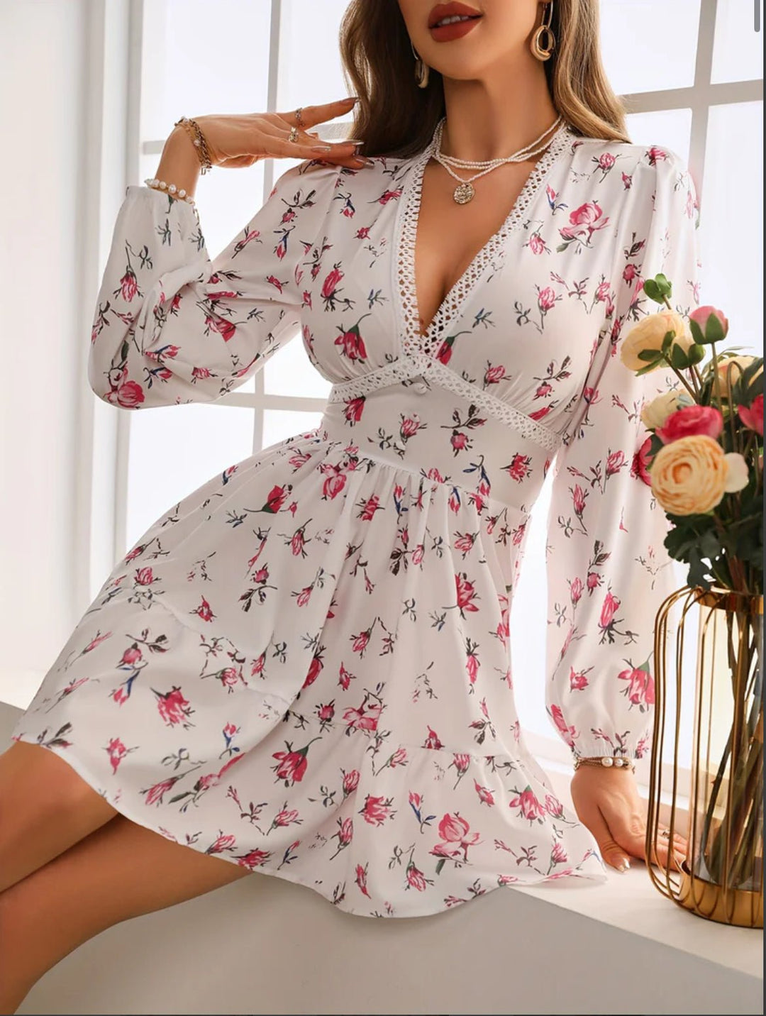 Women's floral mini dress featuring balloon sleeves and a crochet lace V-neck, perfect for summer outings and warm weather occasions. 2