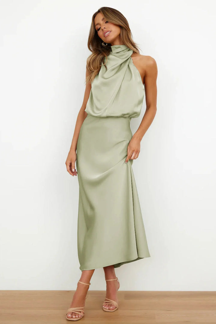 Women's halter evening dress featuring a flowing silhouette, perfect for summer cocktail parties and formal events. 1