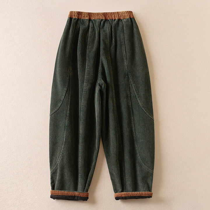Women's harem pants with fleece lining and pockets, featuring a casual cotton blend and relaxed fit, perfect for comfort and style in cool weather. 1