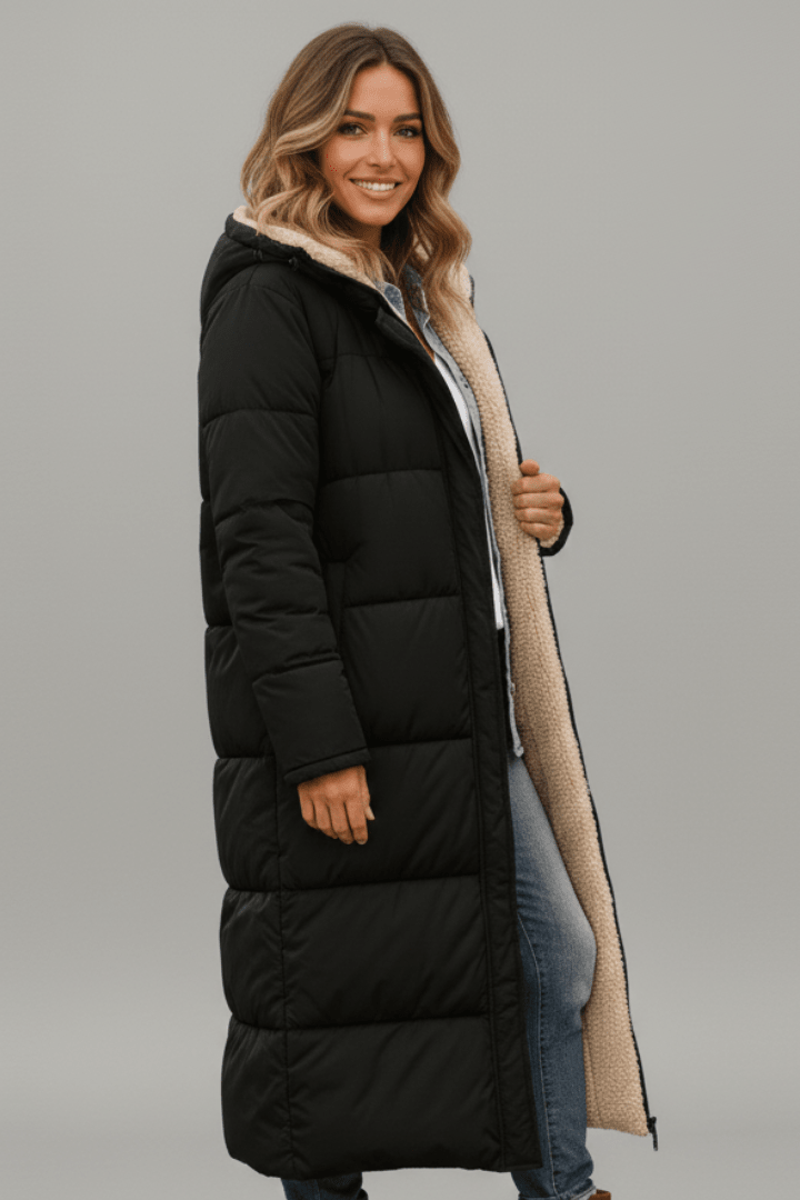 Women's hooded longline puffer coat featuring a soft fleece lining, designed for lightweight warmth and casual winter wear. 2