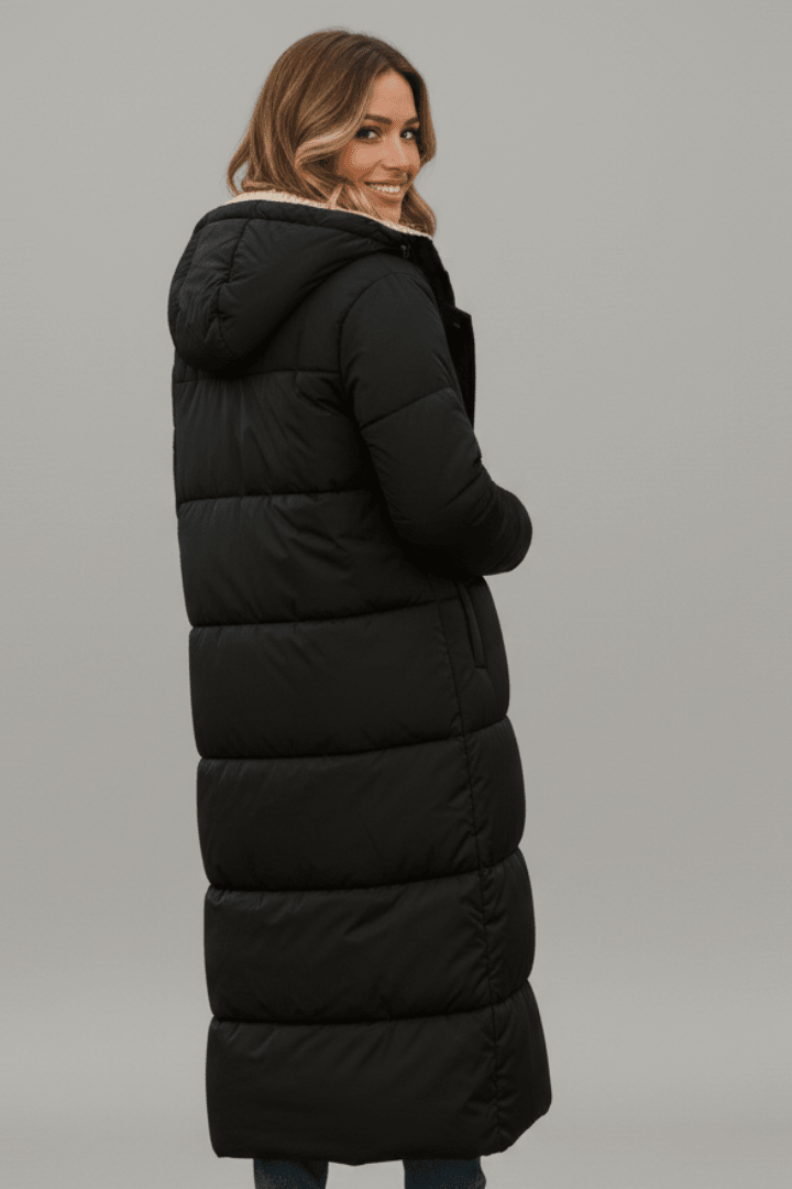 Women's hooded longline puffer coat featuring a soft fleece lining, designed for lightweight warmth and casual winter wear. 3