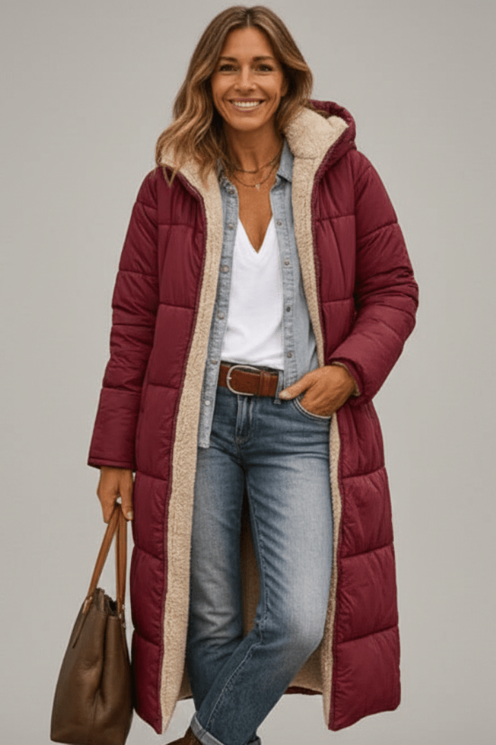 Women's hooded longline puffer coat featuring a soft fleece lining, designed for lightweight warmth and casual winter wear. 7
