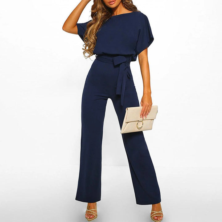 Women's jumpsuit featuring an adjustable belt and short sleeves, perfect for a casual, layer-friendly outfit. 2