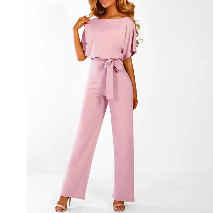 Women's jumpsuit featuring an adjustable belt and short sleeves, perfect for a casual, layer-friendly outfit. 4