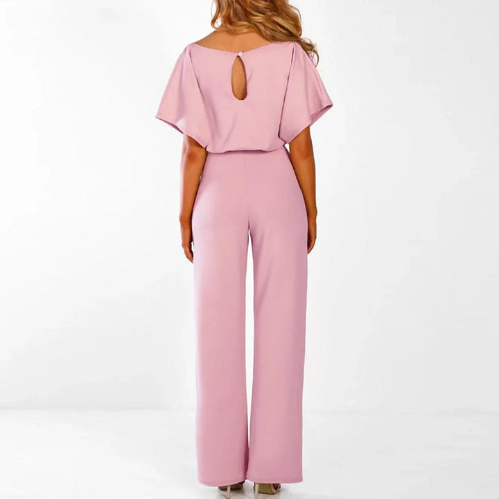 Women's jumpsuit featuring an adjustable belt and short sleeves, perfect for a casual, layer-friendly outfit. 5