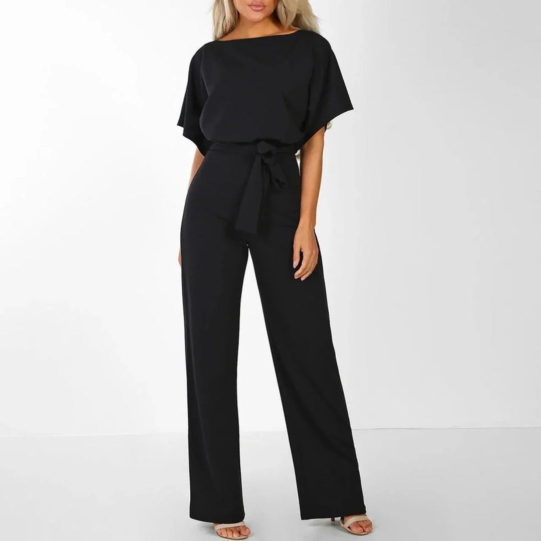 Women's jumpsuit featuring an adjustable belt and short sleeves, perfect for a casual, layer-friendly outfit. 6
