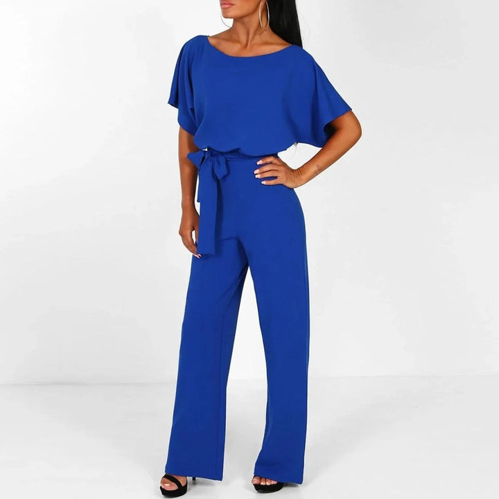 Women's jumpsuit featuring an adjustable belt and short sleeves, perfect for a casual, layer-friendly outfit. 7
